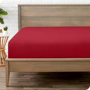 A mattress with just a fitted sheet on it