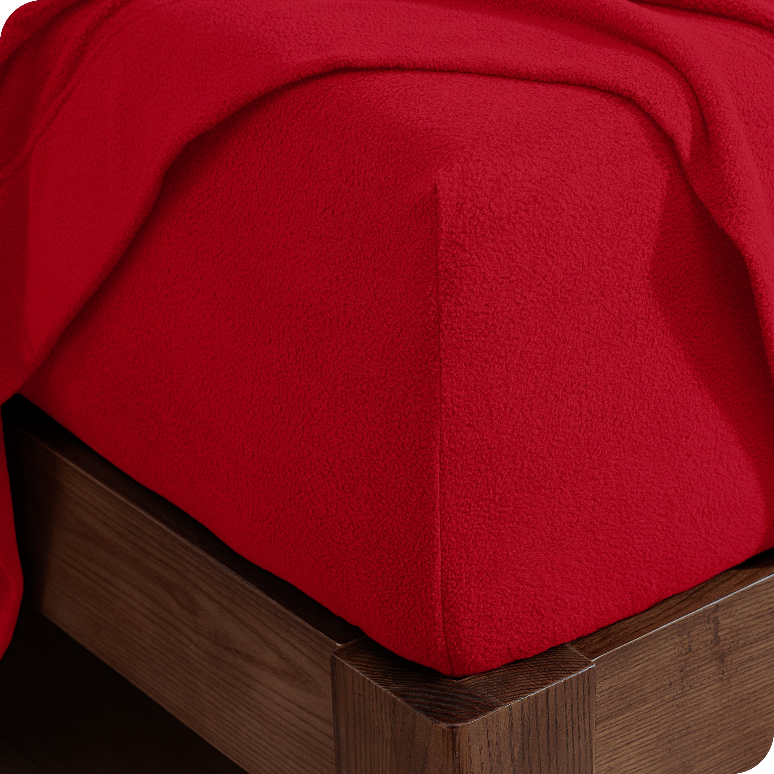 Fitted sheet on a wooden bed frame