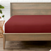 A mattress with just a fitted sheet on it