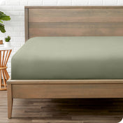 A mattress with just a fitted sheet on it