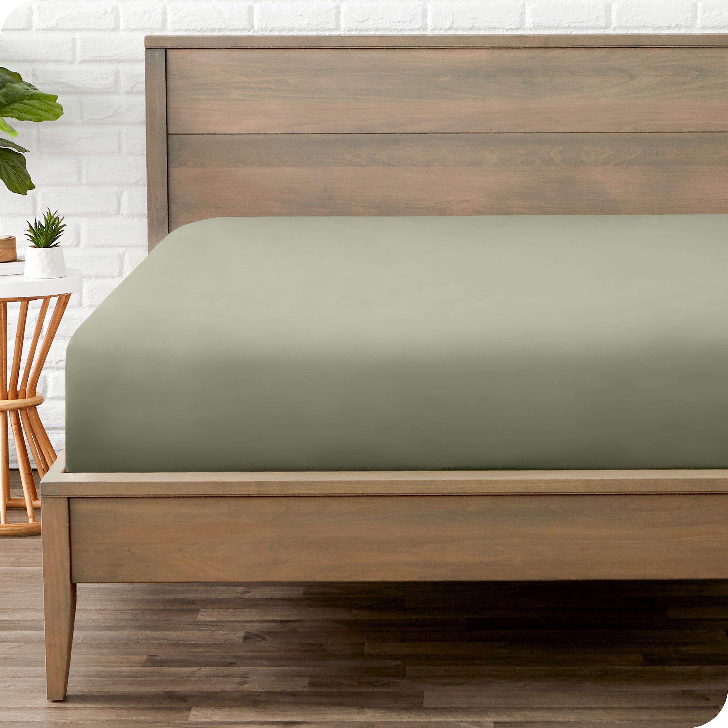 A mattress with just a fitted sheet on it