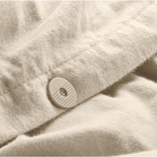 Close up of the button closure on a flannel duvet cover