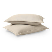 Two pillows stacked on a white background