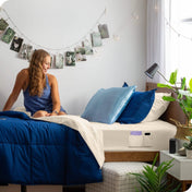 Bed made with a fitted sheet which has pockets on the side