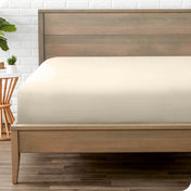 A mattress with just a fitted sheet on it