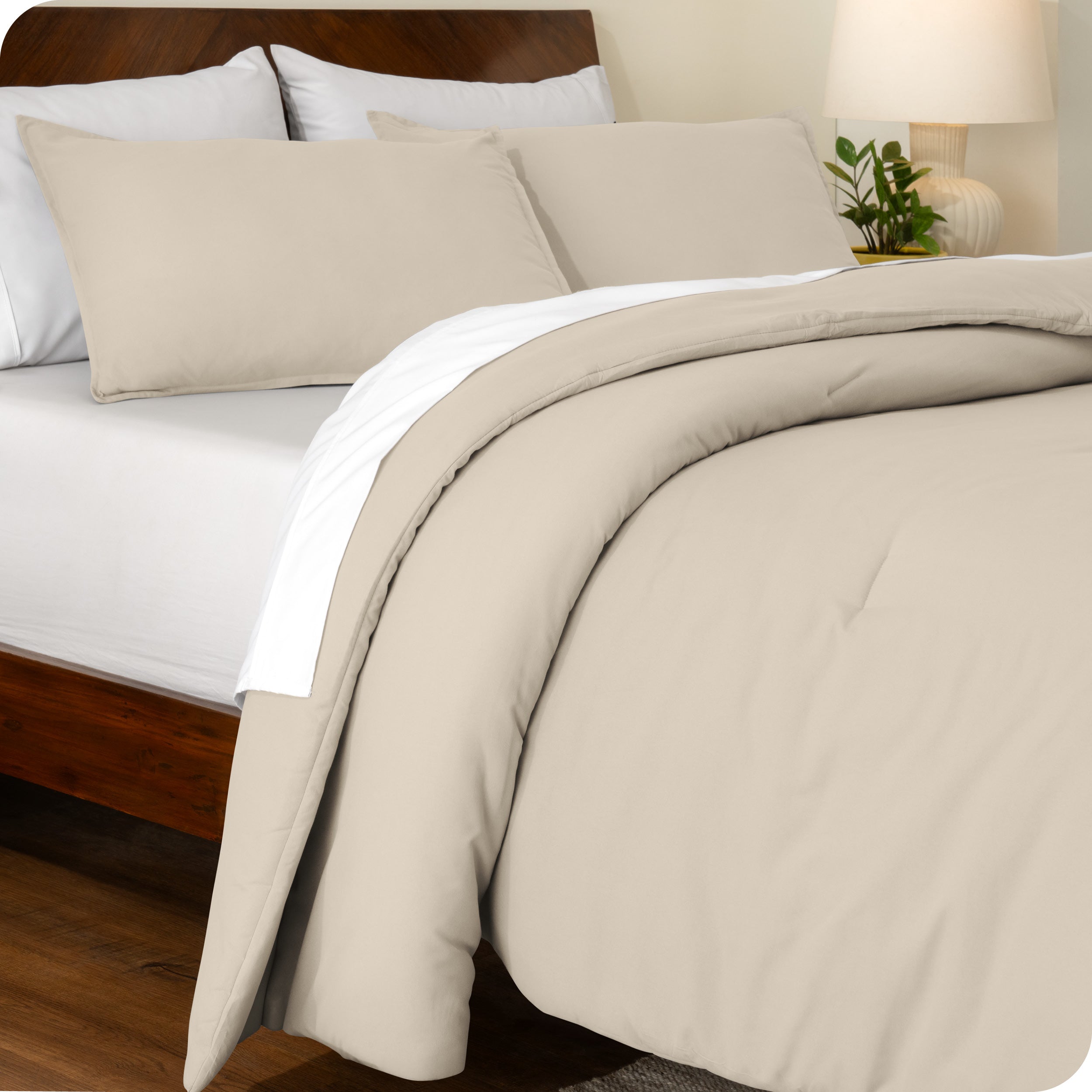 An angled view of a comforter set on a bed