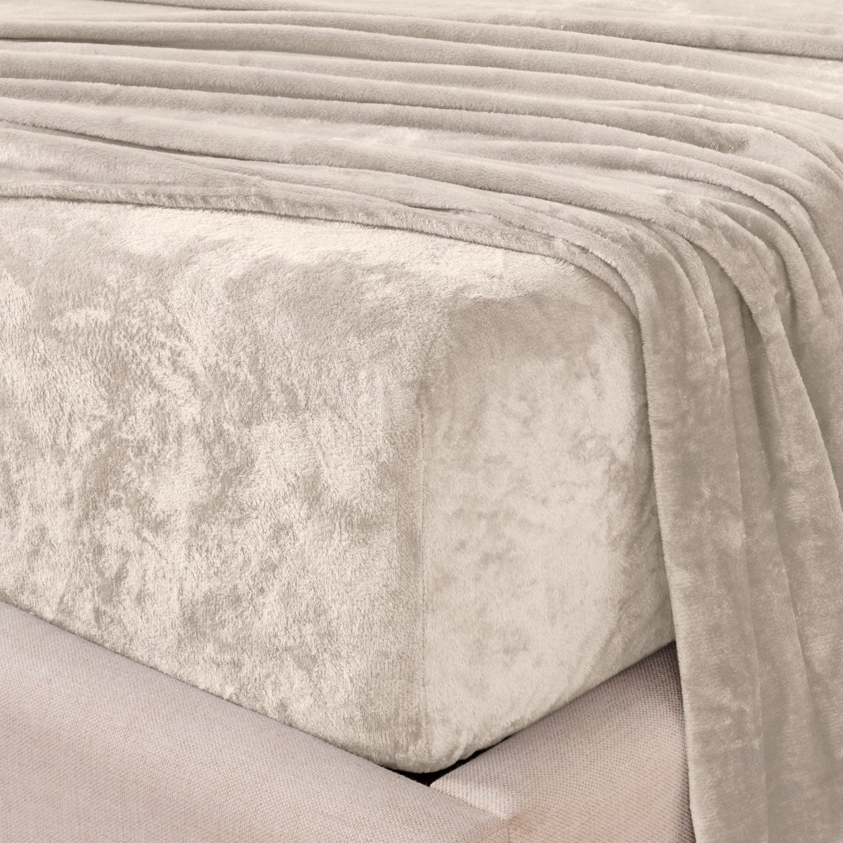 Close-up of the corner of a bed made with microplush sheets