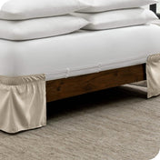 The adjustable elastic bands on a bed skirt