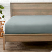 A mattress with just a fitted sheet on it