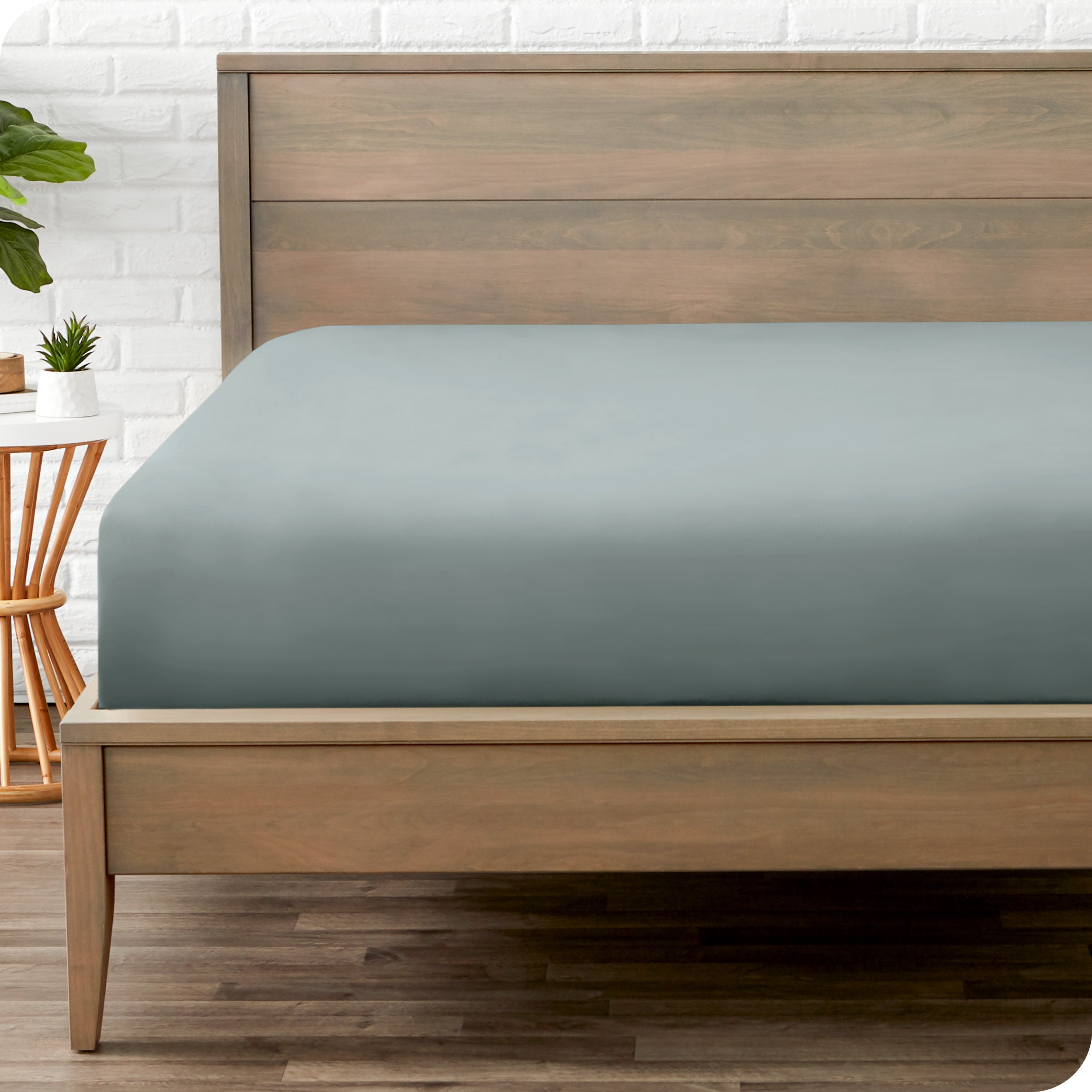 A mattress with just a fitted sheet on it