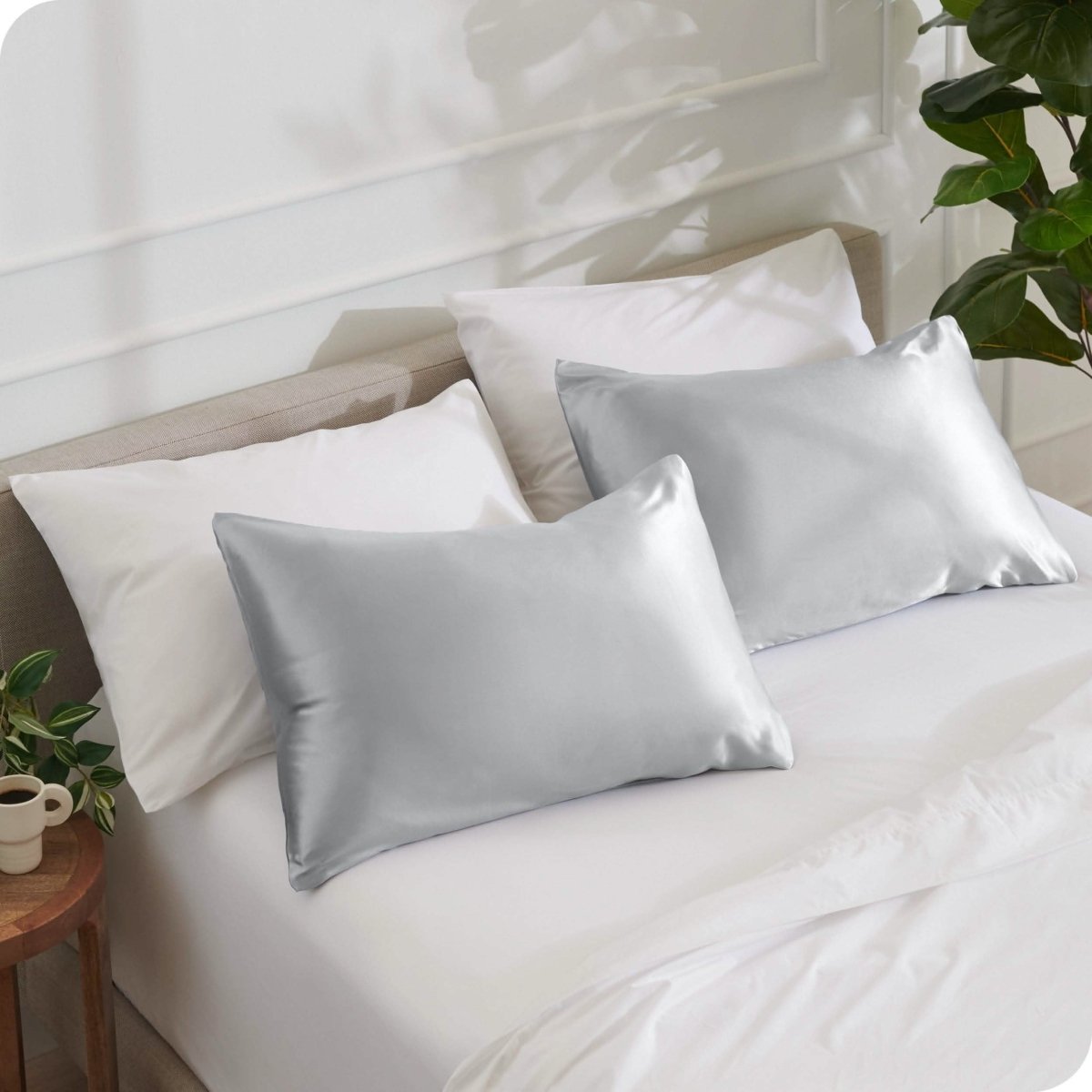 2 mulberry silk pillowcases on pillows set on a bed