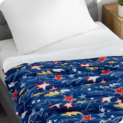 A weighted blanket laid out on a bed.