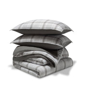 A printed comforter set folded and stacked