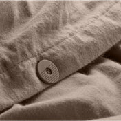Close up of the button closure on a flannel duvet cover