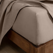 Flannel fitted sheet on a wooden bed frame
