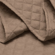 Close in view showing texture of coverlet set fabric