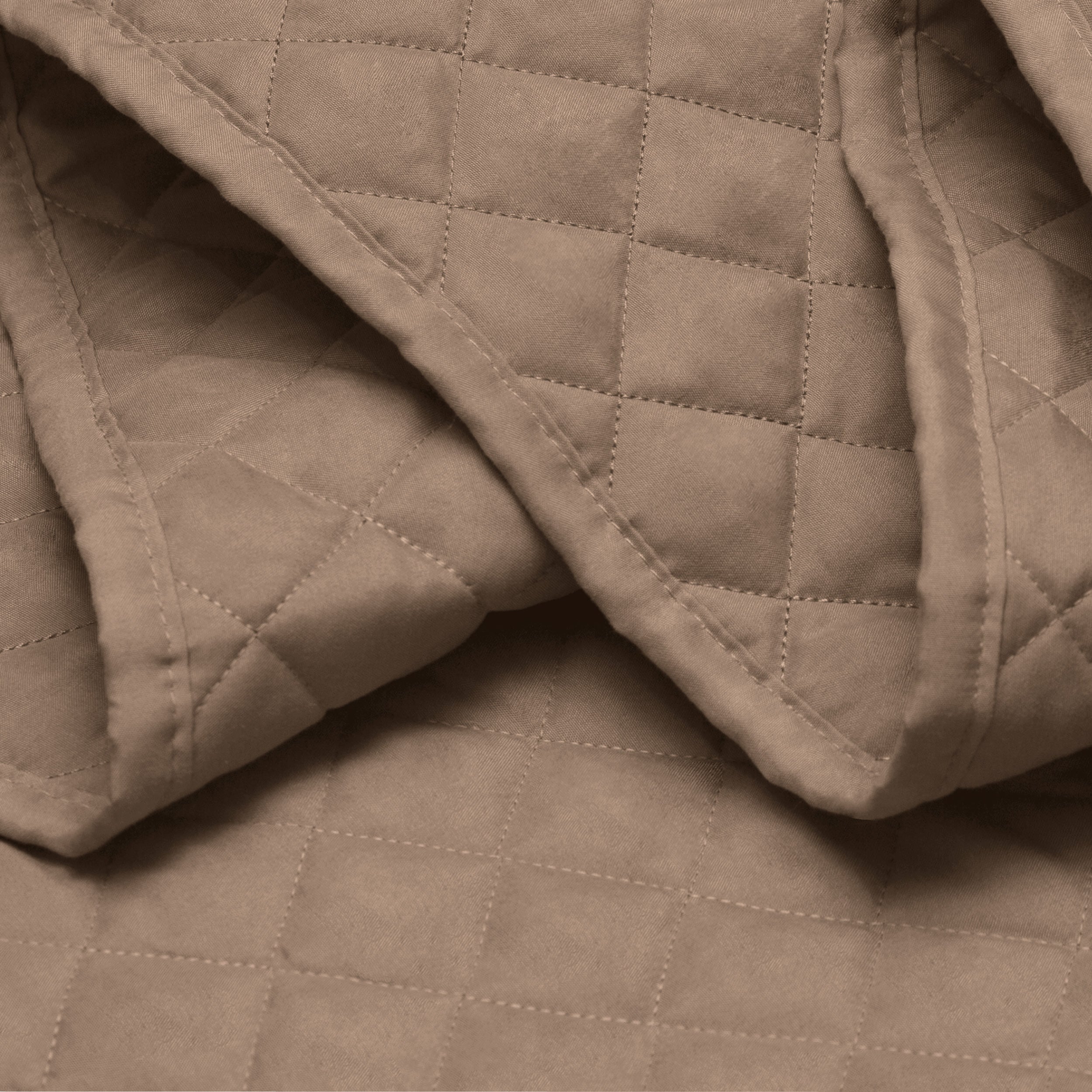 Close in view showing texture of coverlet set fabric