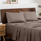 2 pillowcases on pillows on a nicely made bed
