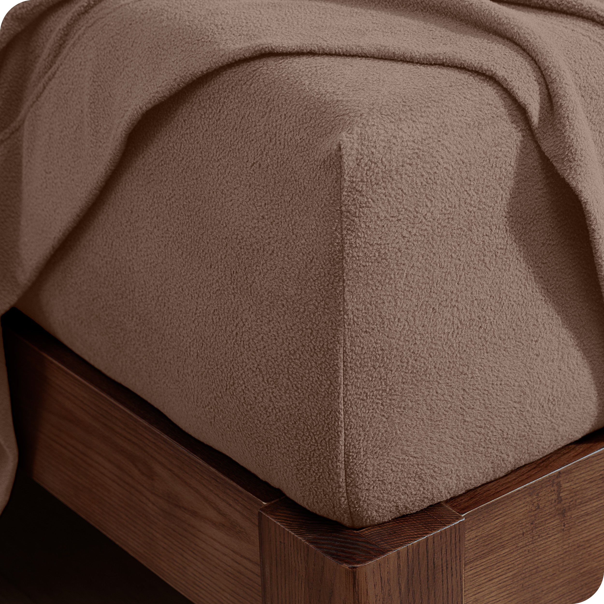 Fitted sheet on a wooden bed frame