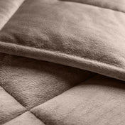 Close-up of a weighted blanket showing the stitching and texture