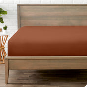A mattress with just a fitted sheet on it