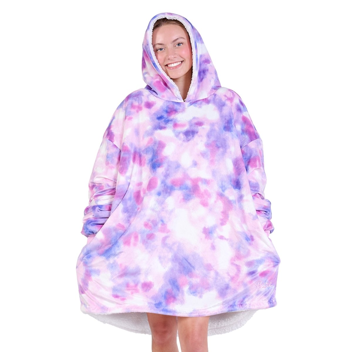 An adult with a sherpa wearable blanket on