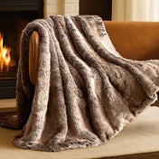Blanket draped over a chair in front of a fireplace