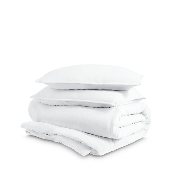 Washed duvet cover and sham set folded and stacked on a white background