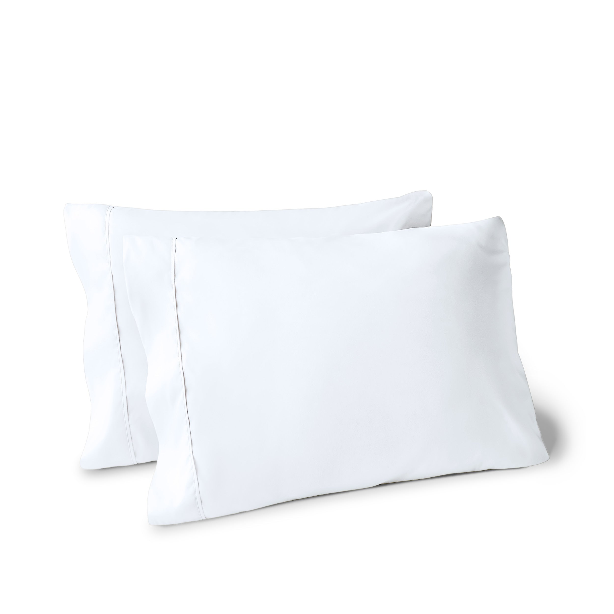 Two pillows on a white background with pillowcases on them