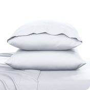 2 pillowcases on pillows