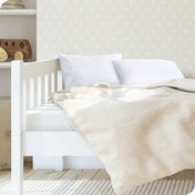 A toddler's bed with 2 microfiber pillowcases on pillows