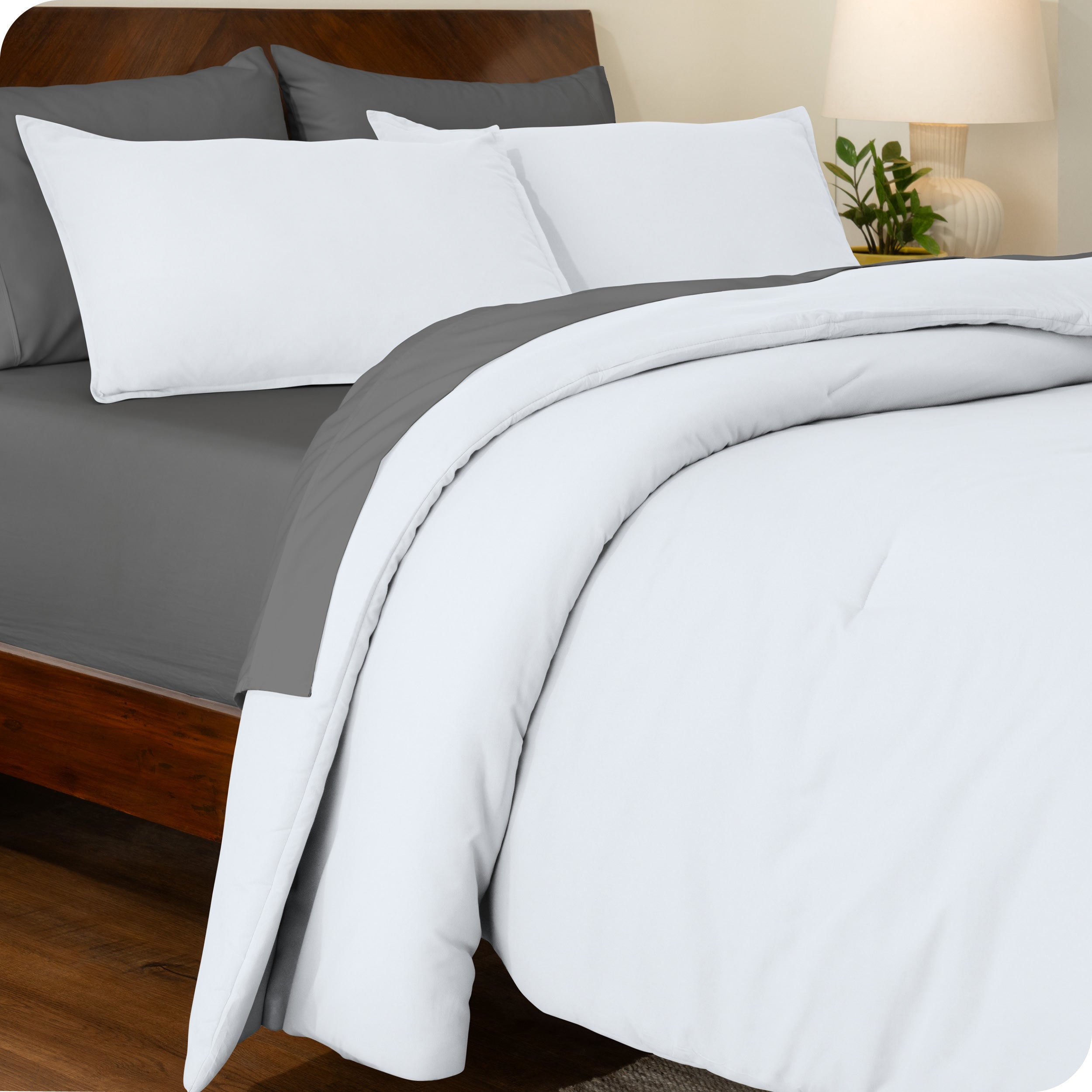An angled view of a comforter set on a bed