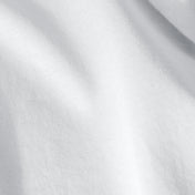 A bed with white pillows and sheets on a wooden headboard.