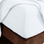 Fitted sheet on a wooden bed frame