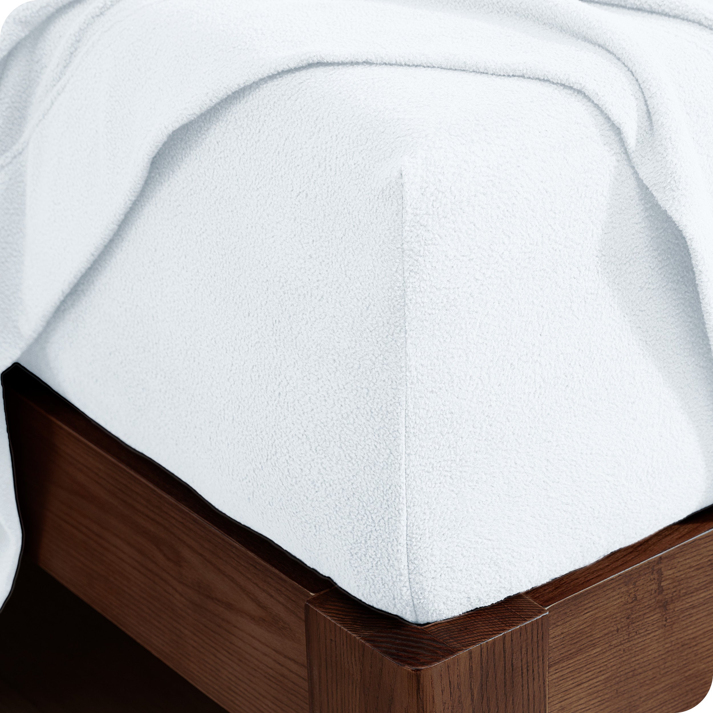 Fitted sheet on a wooden bed frame