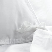 Close up of the corner ties on a duvet cover for attaching a duvet insert