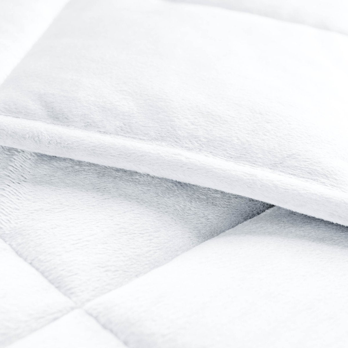 Close-up of a weighted blanket showing the stitching and texture