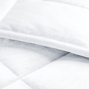 Close-up of a weighted blanket showing the stitching and texture