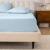 A mattress with a percale fitted sheet on it