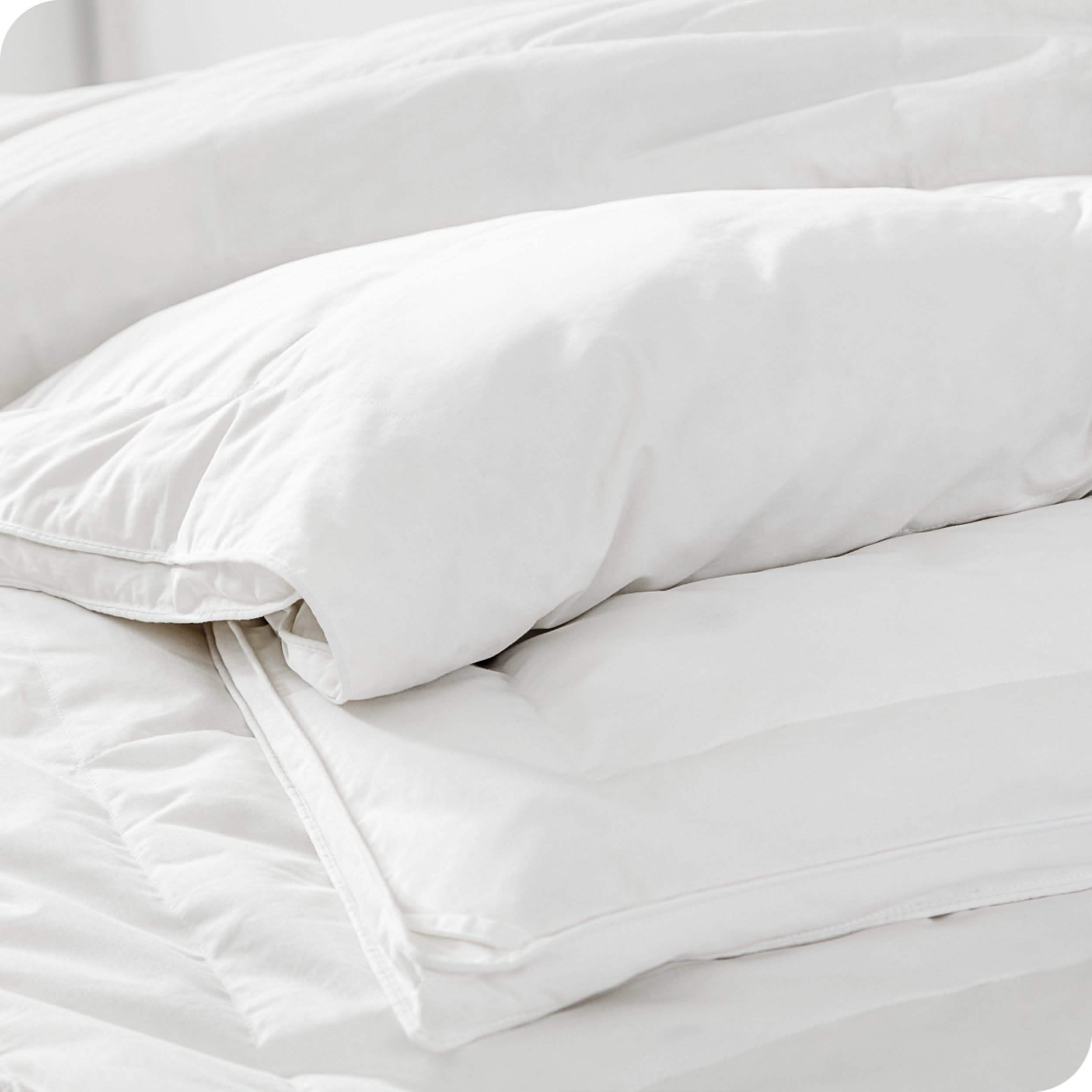 Close in view of comforter showing baffle structure and tie down loops for duvet cover
