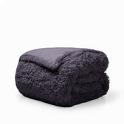 A eggplant shaggy duvet cover folded neatly