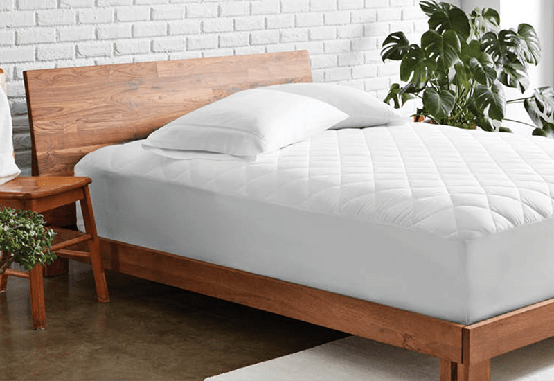 How to Choose Between a Mattress Pad, Protector, or Topper - Bare Home