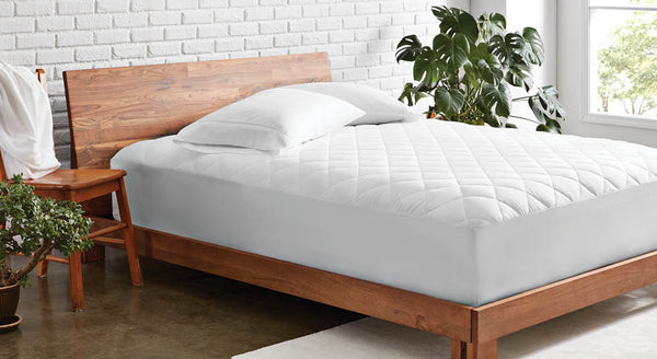 How to Choose Between a Mattress Pad, Protector, or Topper - Bare Home