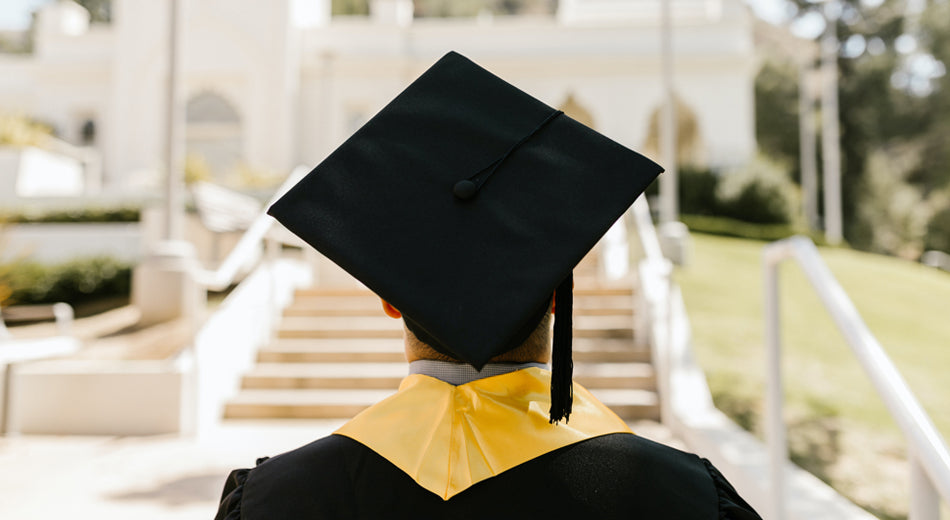 Student graduating with cap and gown on