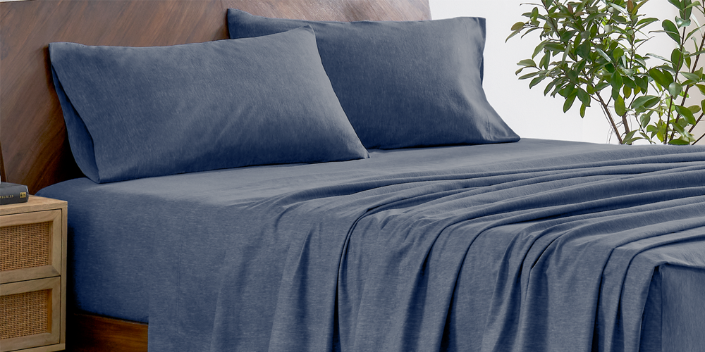 Bed with a heather gray flannel sheet set