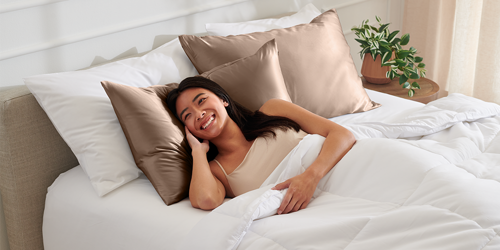 Woman sleeping on a tan mulberry silk pillowcase set