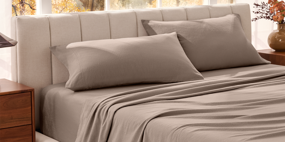 Bed with tan organic flannel sheets