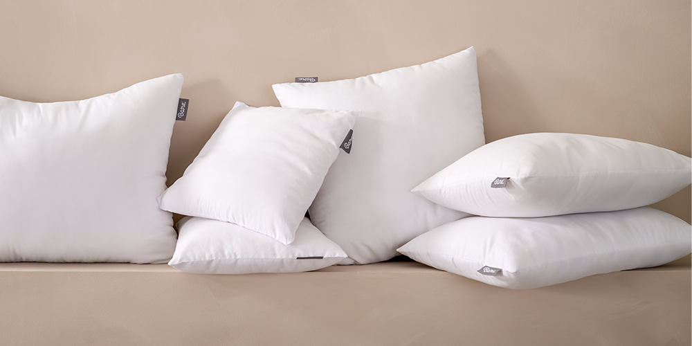 Stack of white Pillow Insert pillows