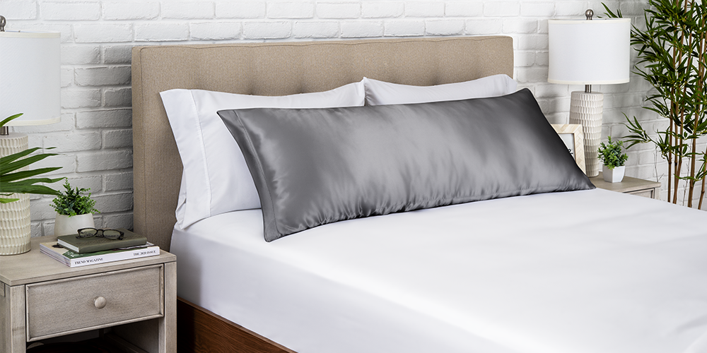 Bed with a gray satin body pillowcase