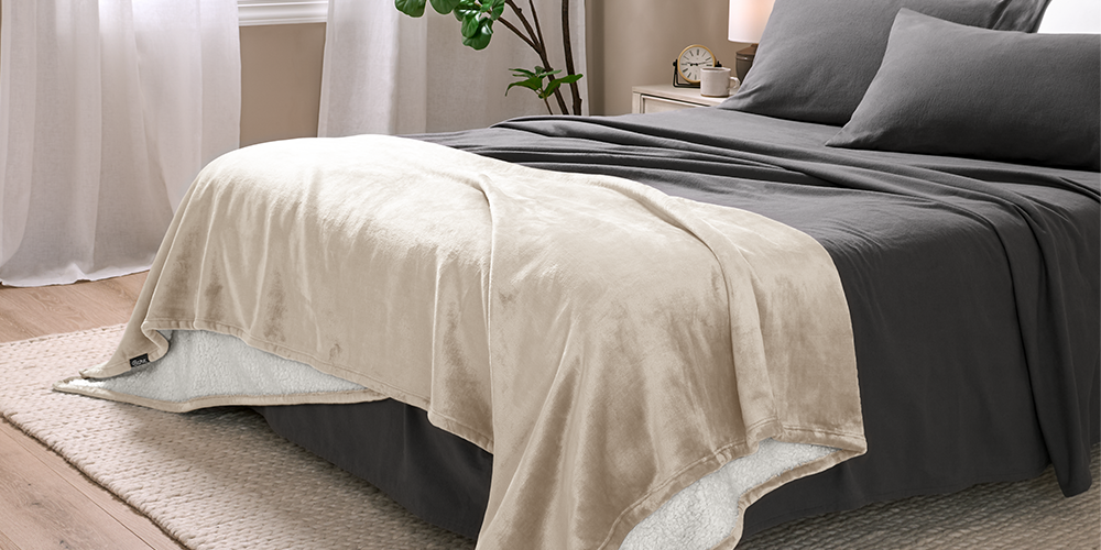Bed with cream Sherpa Blanket